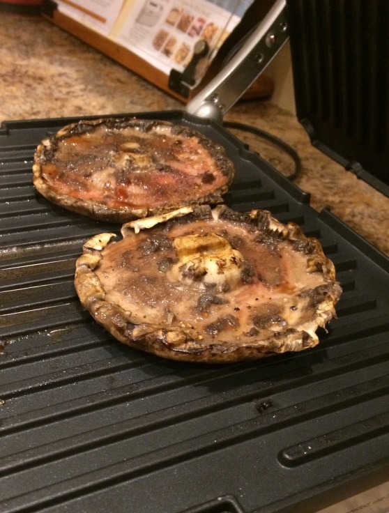 De-gilled mushroom caps on the Griddler.